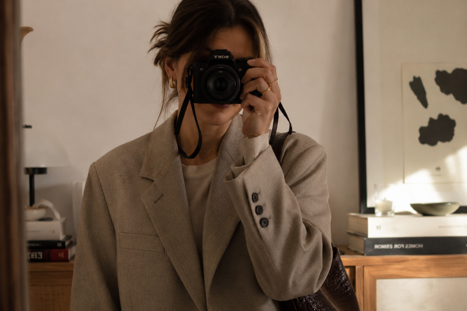 woman taking photo in mirror